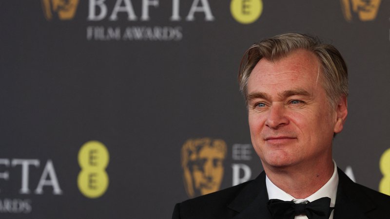Fotografija: V tretje gre rado. Britanski režiser Christopher Nolan je po dveh nominacijah naposled dočakal prvo bafto. FOTO: Adrian Dennis/AFP