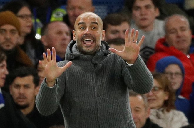 Po porazu v Liverpoolu se je Pep Guardiola spomnil na skupino navijačev, ki so septembra potovali v Harkiv in popirali Manchester City v prvi tekmi lige prvakov v tej sezoni. FOTO: Reuters