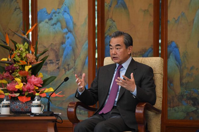 Za Wang Binying na čelu Wipa se je zavzel kitajski zunanji minister Wang Yi. FOTO: Noel Celis/AFP