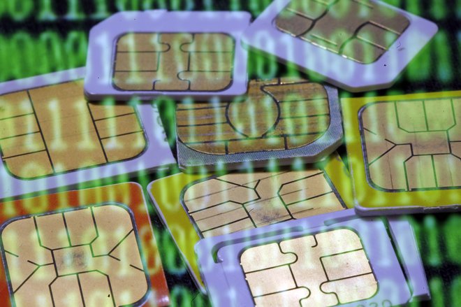 SIM cards are reflected on a monitor showing binary digits in this photo illustration taken in Sarajevo February 23, 2015. Gemalto said February 23, 2015 its initial investigations into a report that U.S. and British spies had hacked it systems showed its products were secure and it thus did not expect a significant financial prejudice. The hack into the world's biggest maker of phone SIM cards allowed the spies to potentially monitor the calls, texts and emails of billions of mobile users around the world, the investigative news website reported. Gemalto makes smart chips for mobile phones, bank cards and biometric passports and counts Verizon , AT&T Inc. and Vodafone among its 450 wireless network provider customers around the world. Picture was taken February 23, 2015.   REUTERS/Dado Ruvic (BOSNIA AND HERZEGOVINA  - Tags: SCIENCE TECHNOLOGY BUSINESS TELECOMS POLITICS CRIME LAW TPX IMAGES OF THE DAY)   - LR2EB2O0TTFF0