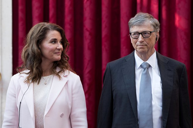 Ustanovitelj Microsofta Bill Gates (levo žena Melinda) je plačal več davkov kot kdorkoli, ampak jih hoče plačati še več. Foto Reuters