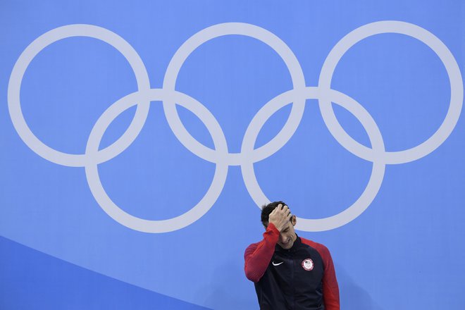 Michael Phelps je s fantastičnimi uspehi postal ikona petih olimpijskih krogov, a plačal visoko ceno. FOTO: AFP
