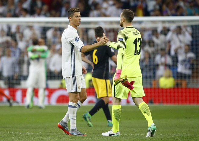 Cristiano Ronaldo je v 32 tekmah zabil Atleticu že 22 golov. Osemkrat je matiral tudi vratarja Jana Oblaka. FOTO: Reuters