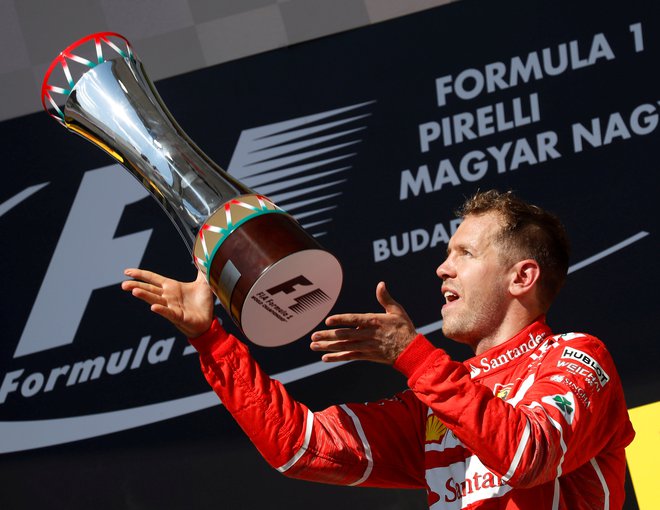 Sebastian Vettel si želi, da bi se v prihodnje pri Ferrariju še tako veselil, kot se je pred tremi leti po zmagi v Budimpešti. FOTO: Reuters