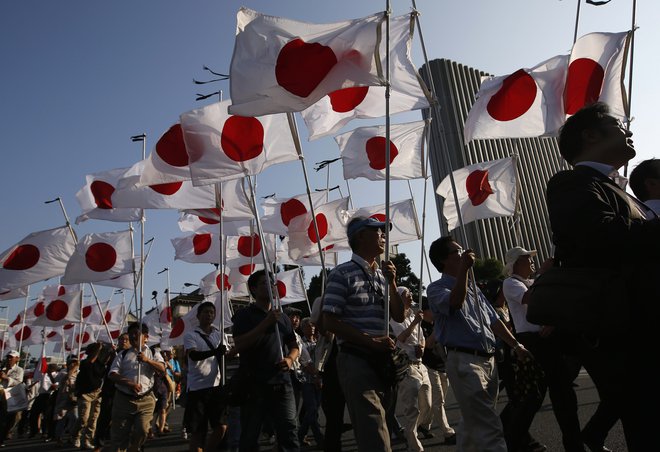 Japonci so se veselili olimpijskih iger, zdaj upajo, da jih bodo imeli v naslednjem letu. FOTO: Reuters