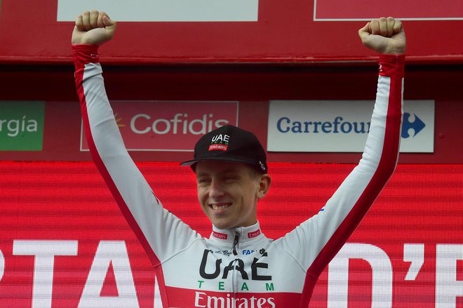 Team UAE Emirates rider Slovenia's Tadej Pogacar celebrates on the podium after winning the ninth stage of the 2019 La Vuelta cycling tour of Spain, a 94,4 km race from Andorra la Vella to Cortals d'Encamp on September 1, 2019 in Els Cortals. (Photo by JOSE JORDAN / AFP)