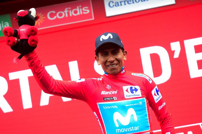 Team Movistar rider Colombia's Nairo Quintana, wearing the leader´s red jersey, celebrates on the podium after  the ninth stage of the 2019 La Vuelta cycling tour of Spain, a 94,4 km race from Andorra la Vella to Cortals d'Encamp on September 1, 2019 in E