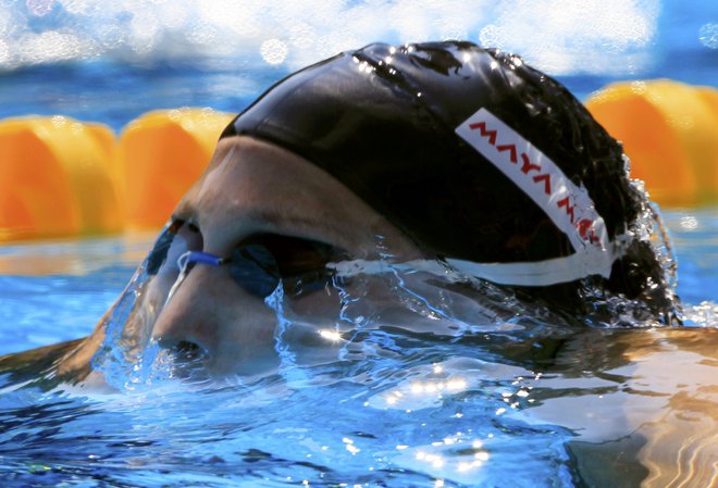 Najboljši plavalci in plavalke se bodo za kolajne na svetovnem prvenstvu v Fukuoki potegovali šele leta 2022. FOTO: Reuters