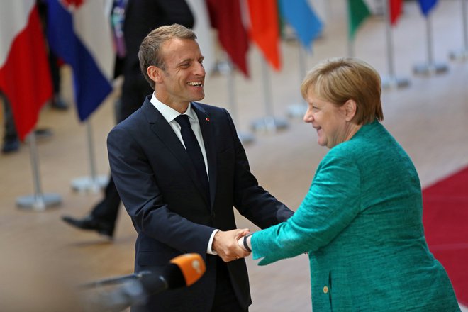 Francoski predsednik in nemška kanclerka se bosta danes srečala v Marseillu. FOTO: Reuters