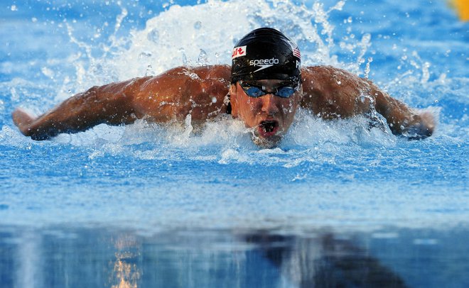 Michael Phelps je bil prvič na OI pri 15 letih v Sydneyju. FOTO: Reuters