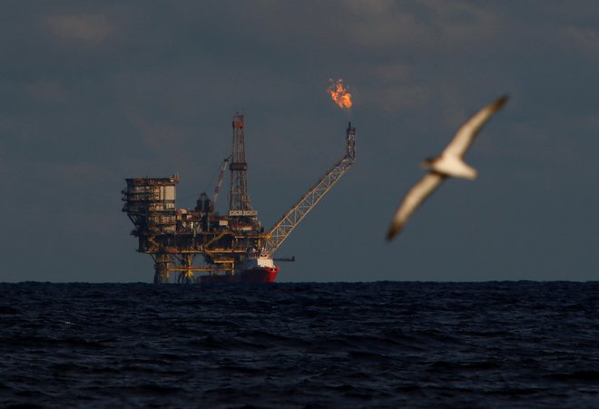 A seagull flies in front of an oil platform in the  Bouri Oilfield some 70 nautical miles north of the coast of Libya, October 5, 2017.   REUTERS/Darrin Zammit Lupi - RC1249351C40