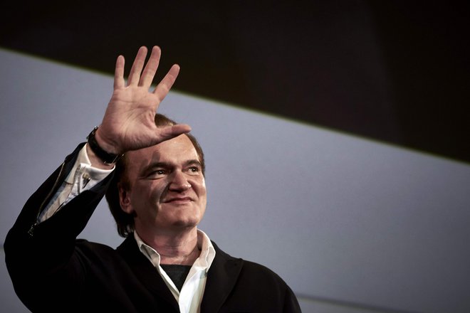 Kljub kričeči histeriji, ki spremlja vsak njegov korak po rdeči preprogi, Tarantino v Cannesu najde nirvano. FOTO: AFP