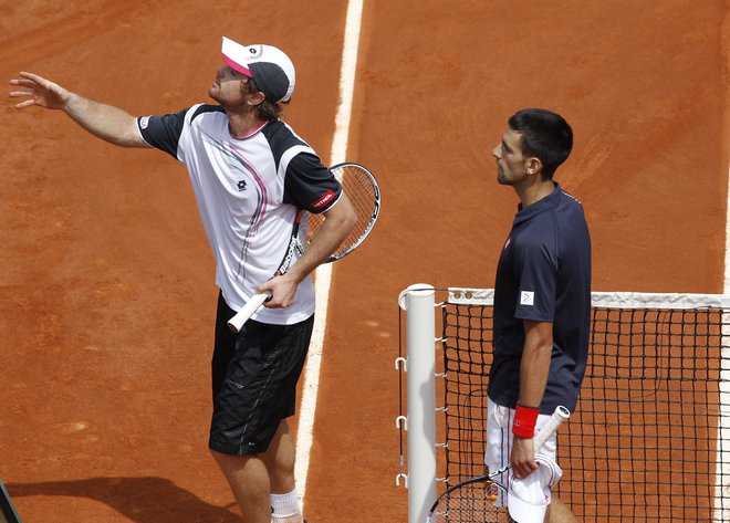 Na OP Francije se je Blaž Kavčič meril tudi s prvim igralcem sveta Novakom Đokovićem. FOTO: Reuters