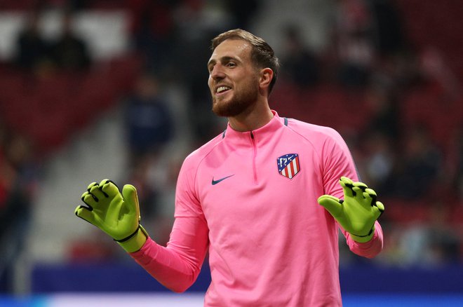 Jan Oblak bo še naprej nosil dres madridskega Atletica. FOTO: Sergio Perez/Reuters