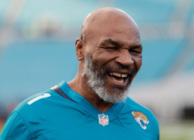 (FILES) In this file photo taken on September 19, 2019, former world heavyweight champion Mike Tyson before the start of the Tennessee Titans at Jacksonville Jaguars in Jacksonville, Florida. - Tyson, who retired in 2005, said on July 23, 2020, he will make a comeback at age 54, fighting Roy Jones Jr. on September 12 in Los Angeles. On his Legends Only League website, Tyson announced the bout against Jones, a 51-year-old fighter who briefly held the heavyweight title and has fought consistently into his 50s. "It's just going to be amazing," Tyson said. (Photo by James Gilbert / GETTY IMAGES NORTH AMERICA / AFP)