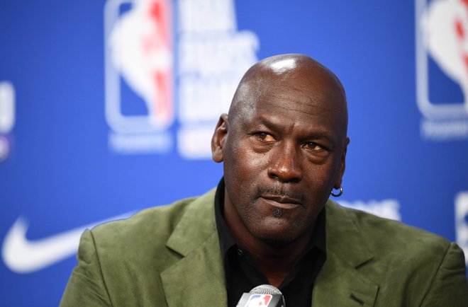 75 odstotkov košarkarjev v ligi NBA je Afroameričanov, edini temnopolti lastnik kluba je Michael Jordan. FOTO: Franck Fife/AFP