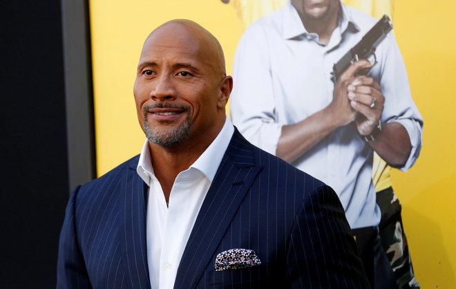 Igralec in nekdanji rokoborec Dwayne Johnson je dejal, da je bil celo zanj virus zahteven nasprotnik. FOTO: Mario Anzuoni/Reuters 