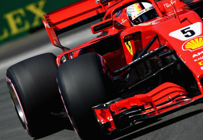 Sebastian Vettel je prekinil Ferrarijev kvalifikacijski urok v Montrealu. Foto Mark Thompson/AFP