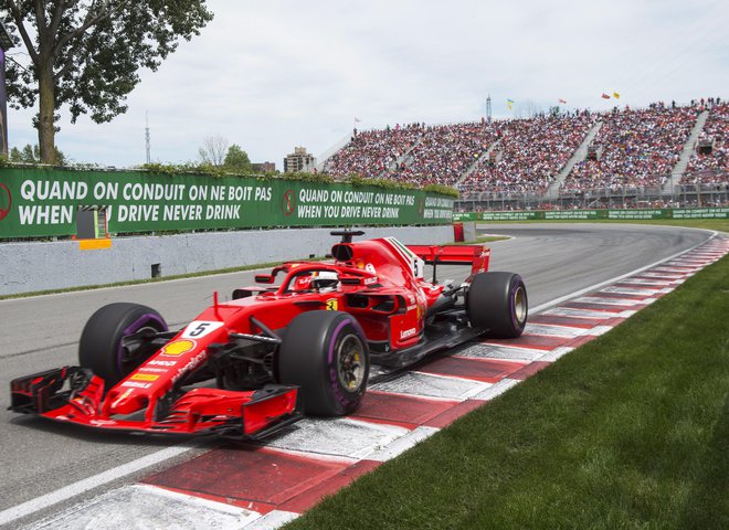 Sebastian Vettel se je po štirih dirkah vrnil na vrh zmagovalnega odra. Foto Ryan Remiorz/AP
