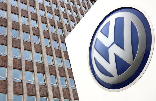 A Volkswagen logo is pictured in front of a company building in Wolfsburg, Germany, Friday, April 13, 2018. (AP Photo/Michael Sohn)