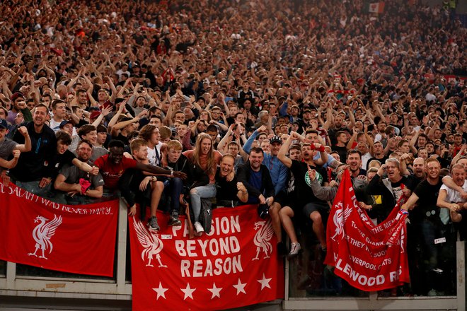 Navijači Liverpoola med slavjem na rimskem olimpijskem štadionu.