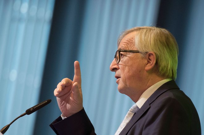 Jean Claude Juncker poudarja, da imajo dolžnost zaščititi evropska podjetja. FOTO: John Thys/Afp
