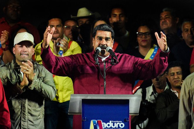 &raquo;Mir in demokracija sta zmagala,&laquo; je ob ponovni izvolitvi dejal Maduro. FOTO: Federico Parra/AFP