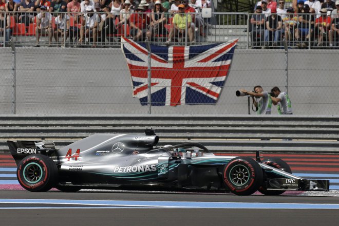 Lewis Hamilton je zmagal tretjič v sezoni. Foto Claude Paris/AP