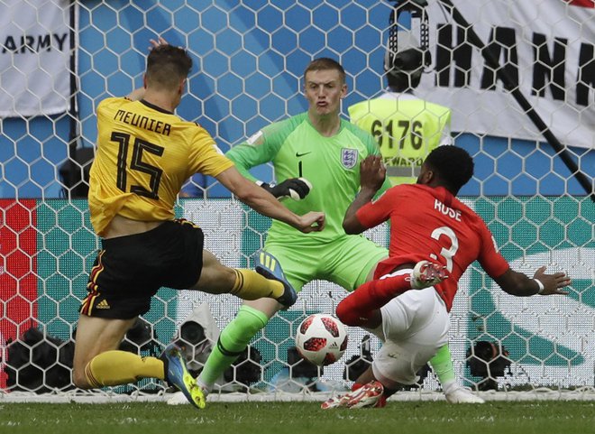 Thomas Meunier je postal deseti strelec za belgijsko reprezentanco, ko je že v četrti minuti premagal Jordana Pickforda. Foto: AP