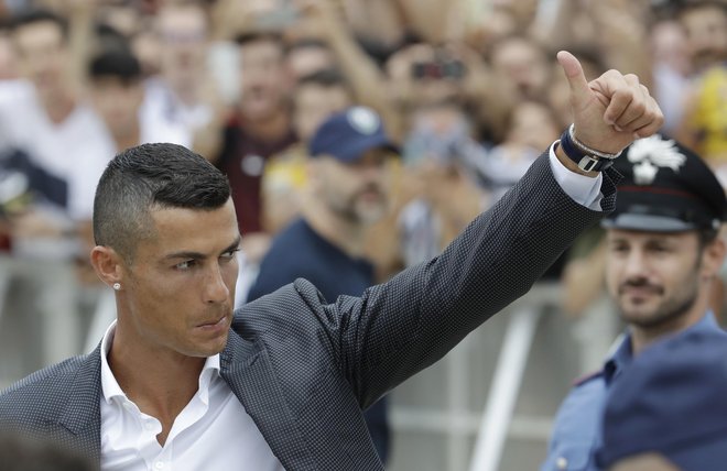 Cristiano Ronaldo se je pred tedni preselil v Italijo. FOTO: Luca Bruno/AP