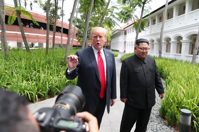 Donald Trump in Kim Džong Un FOTO: Jonathan Ernst/Reuters