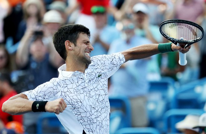 Novak Đoković se je zmage nepopisno razveselil. FOTO: Rob Carr/AFP