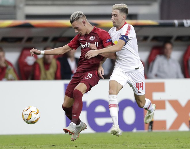 Kevin Kampl je s kapetanskim trakom na roki ostal praznih rok. FOTO: Michael Sohn/AP