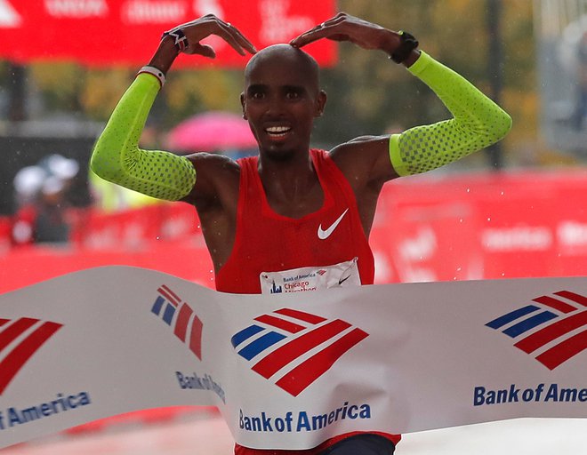 V Somaliji rojen Mo Farah, lastnik štirih olimpijskih kolajn, sicer britanski reprezentant, je bil prvi, ki je prečkal ciljno črto na maratonu v Chicagu.&nbsp; FOTO: Jim Young/AFP