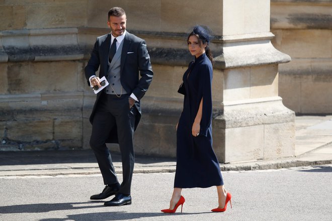 David in Victoria Beckham na poroki princa Harryja in Meghan Markle FOTO: AFP