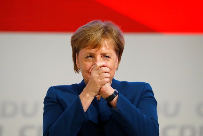 Nemška kanclerka Angela Merkel na kongresu stranke. FOTO: Fabrizio Bensch/Reuters