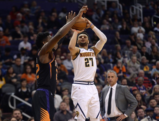 Jamal Murray je kljub poškodbi gležnja zadel kar devet trojk. FOTO: Joe Camporeale/Reuters