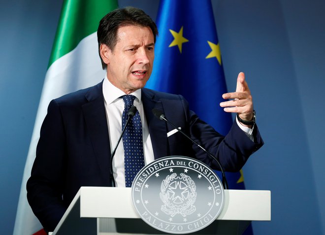 Predsednik vlade je zagotovil, da bodo Italijani&nbsp;nemudoma občutili pozitivne učinke proračuna. FOTO: Francois Lenoir/Reuters