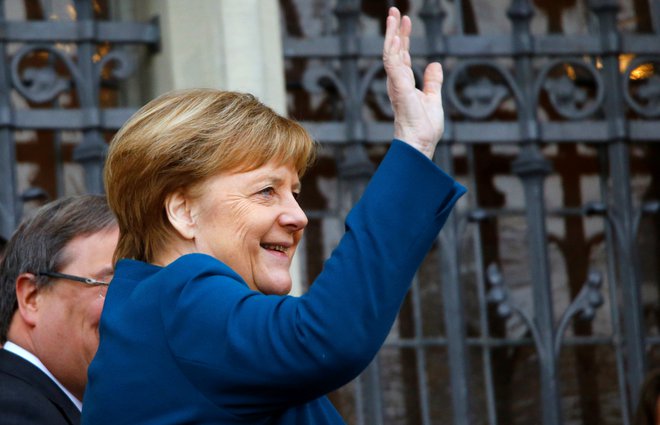 Nemška kanclerka Angela Merkel je v Aachnu dobre volje. FOTO: Reuters