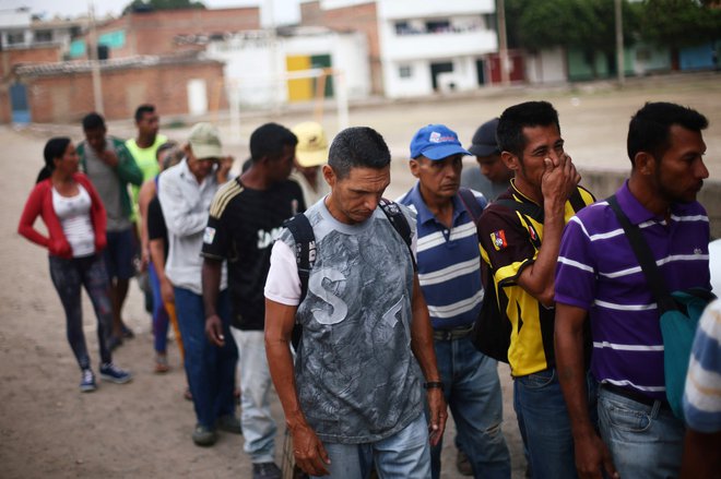 Venezuelo je v zadnjih petih letih zapustilo več kot dva milijona ljudi. Na fotografiji migranti v Cucuti, mestu na meji med Venezuelo in Kolumbijo. FOTO: Edgard Garrido/Reuters