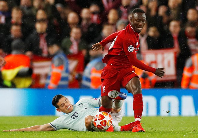 Soccer Football - Champions League - Round of 16 First Leg - Liverpool v Bayern Munich - Anfield, Liverpool, Britain - February 19, 2019  Liverpool's Naby Keita in action with Bayern Munich's James Rodriguez        REUTERS/Phil Noble