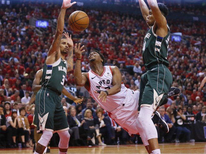 Kyle Lowry (na sredini) je k zmagi Toronta tokrat prispeval 25 točk. FOTO: Usa Today Sports