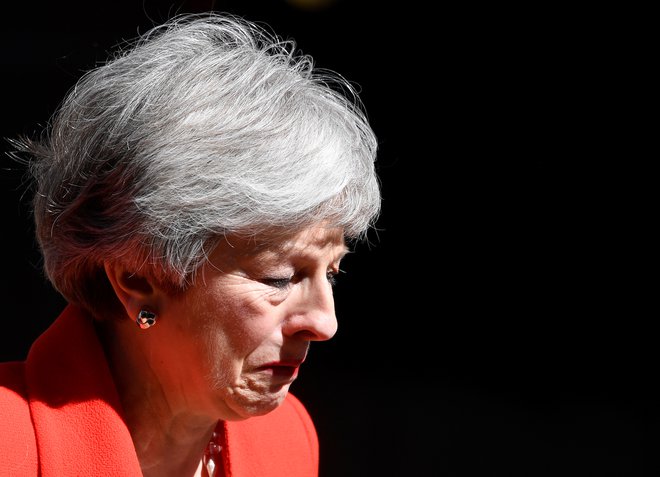 Theresa May se umika. FOTO: Toby Melville/Reuters