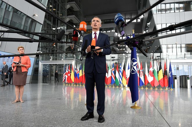 NATO Secretary General Jens Stoltenberg make a statement to the press at the doorstep at the NATO headquarters during a Defence Ministers meeting in Brussels on June 26, 2019. (Photo by JOHN THYS / AFP)