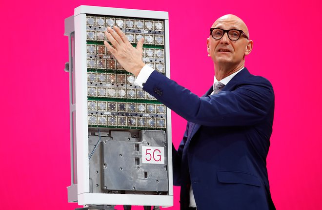 Timotheus Hoettges, CEO of Deutsche Telekom AG, stands in front of a 5G antenna of Swedish network infrastructure provider Ericsson during the company's annual shareholder meeting in Bonn, Germany March 28, 2019. REUTERS/Wolfgang Rattay - RC1D49F0B760