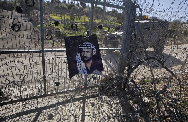 Če vas vprašajo, od kod ste, recite, da iz dežele, katere zgodovina je Jaser Arafat!<em> </em>FOTO: Mussa Qawasma/Reuters