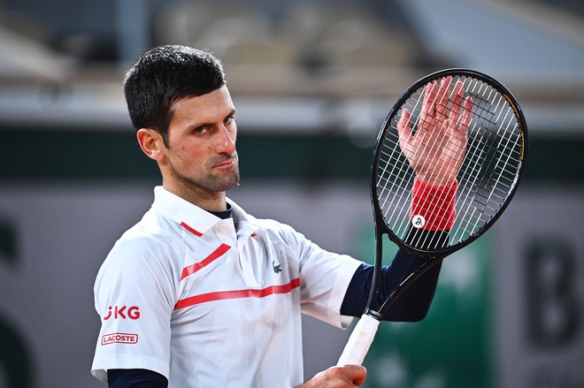 Novak Đoković si je zaploskal za novo zmago. FOTO: Anne-christine Poujoulat/AFP