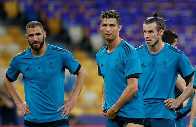 (Nekdanji) Realovi asi Karim Benzema, Cristiano Ronaldo in Gareth Bale na večer 25. maja 2018 v finalu lige prvakov v Kijevu. FOTO: Gleb Garanich/Reuters