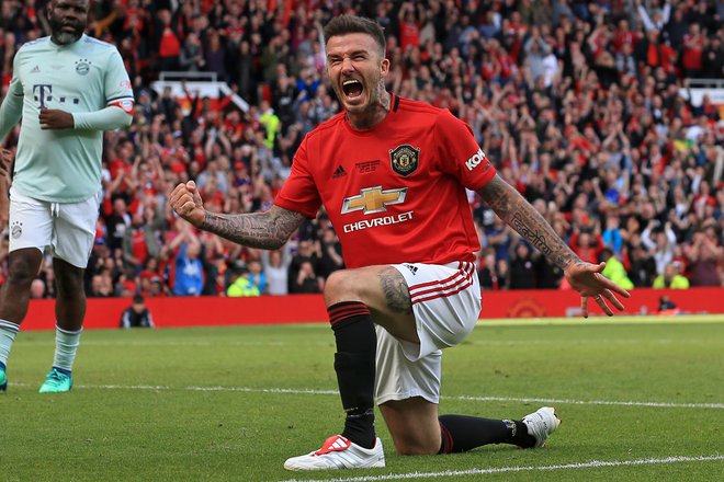 David Beckham med revijalno tekmo legend Manchester Uniteda in Bayerna iz 26. maja 2019 na Old Traffordu. FOTO: Lindsey Parnaby/AFP