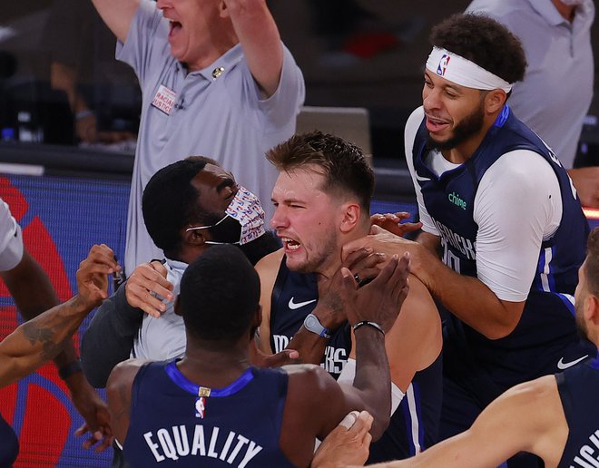 Z Luko Dončićem bosta poslej igrala tudi Avstralec Josh Green in Američan Tyler Bey. FOTO: Kevin C. Cox/AFP